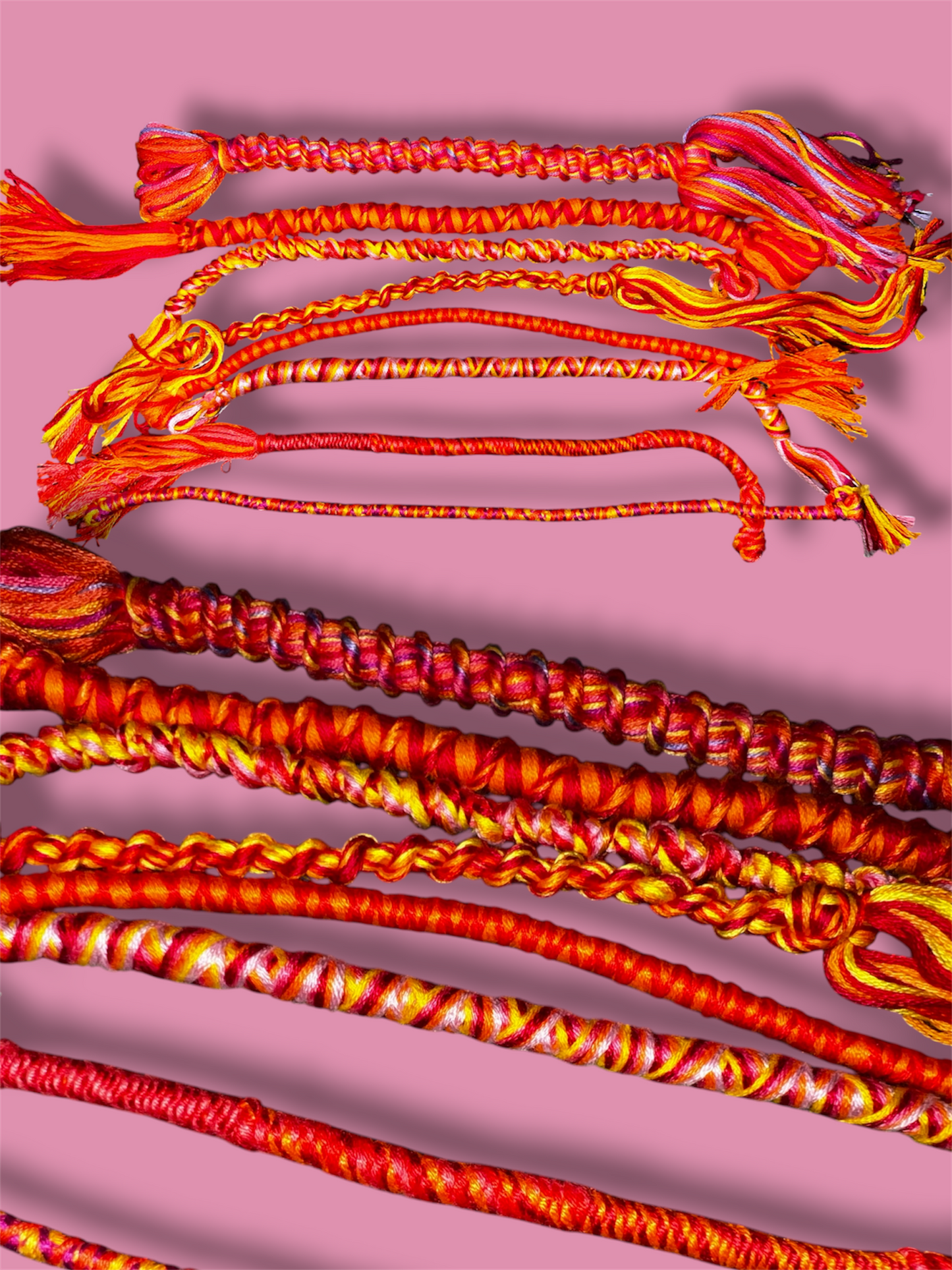 Vaguely Lesbian Pride themed thread bracelets