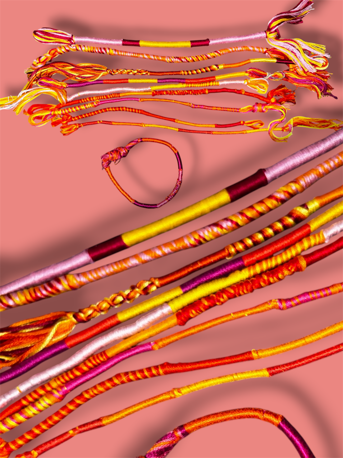 Vaguely Lesbian Pride themed thread bracelets